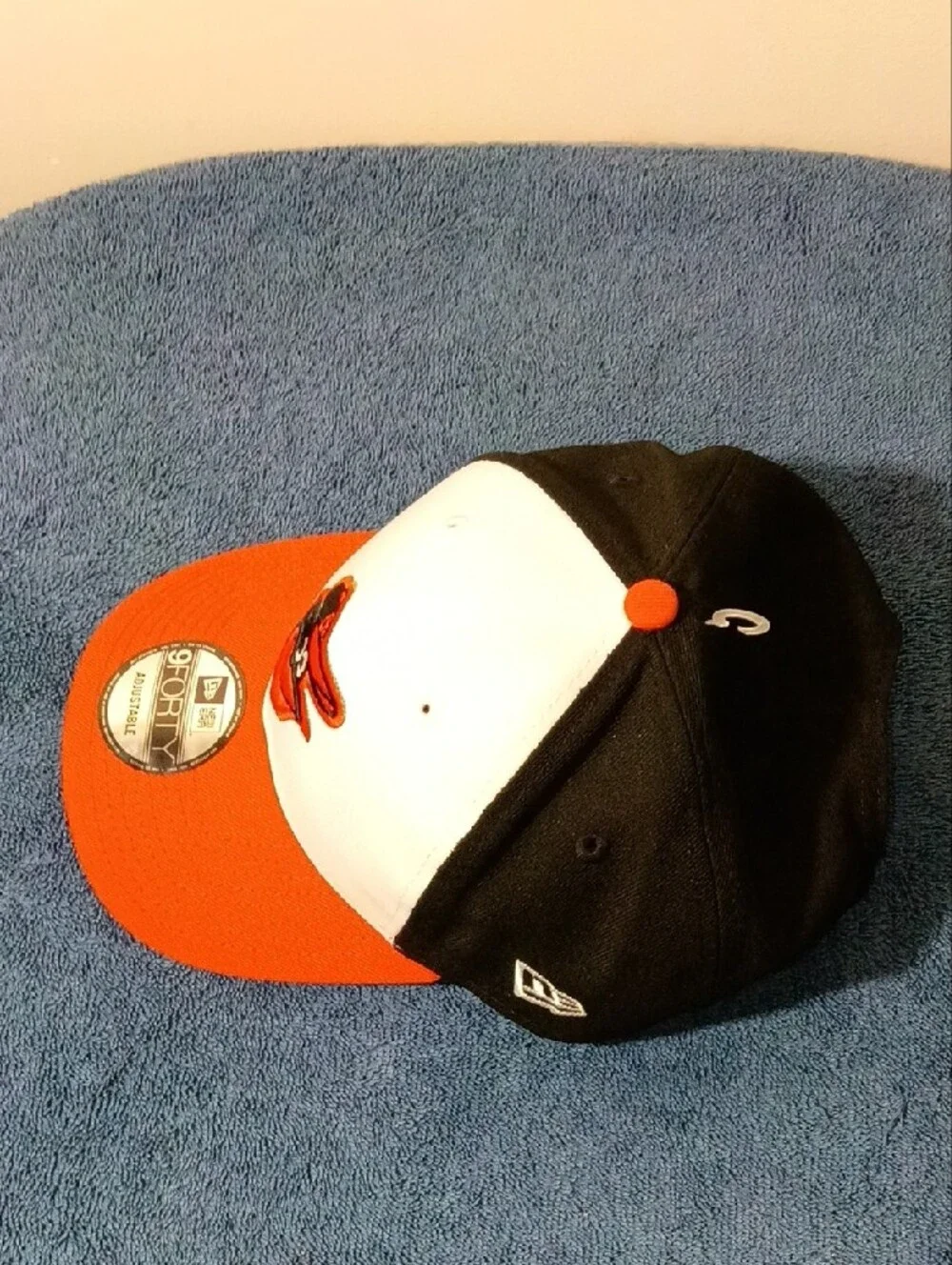New Era Orioles 9FORTY Cap in White, Black, Orange